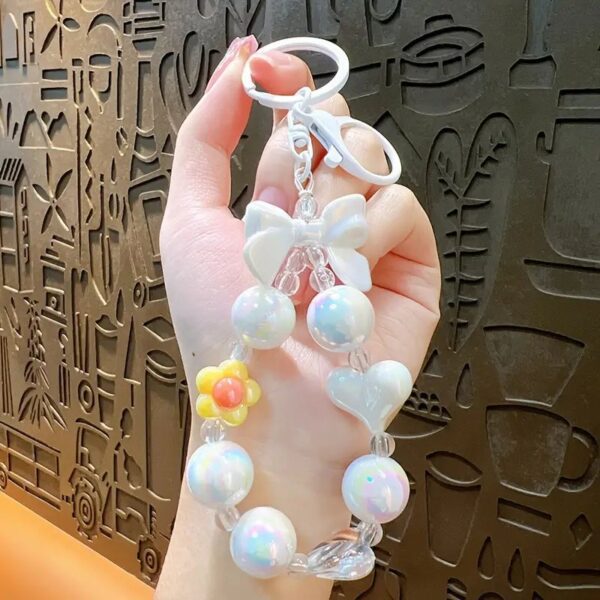 قلادة هاتف محمول بتصميم جديد مطلي بالكهرباء على شكل زهرة صغيرة مع سلسلة مفاتيح وإكسسوارات زينة للحقيبة